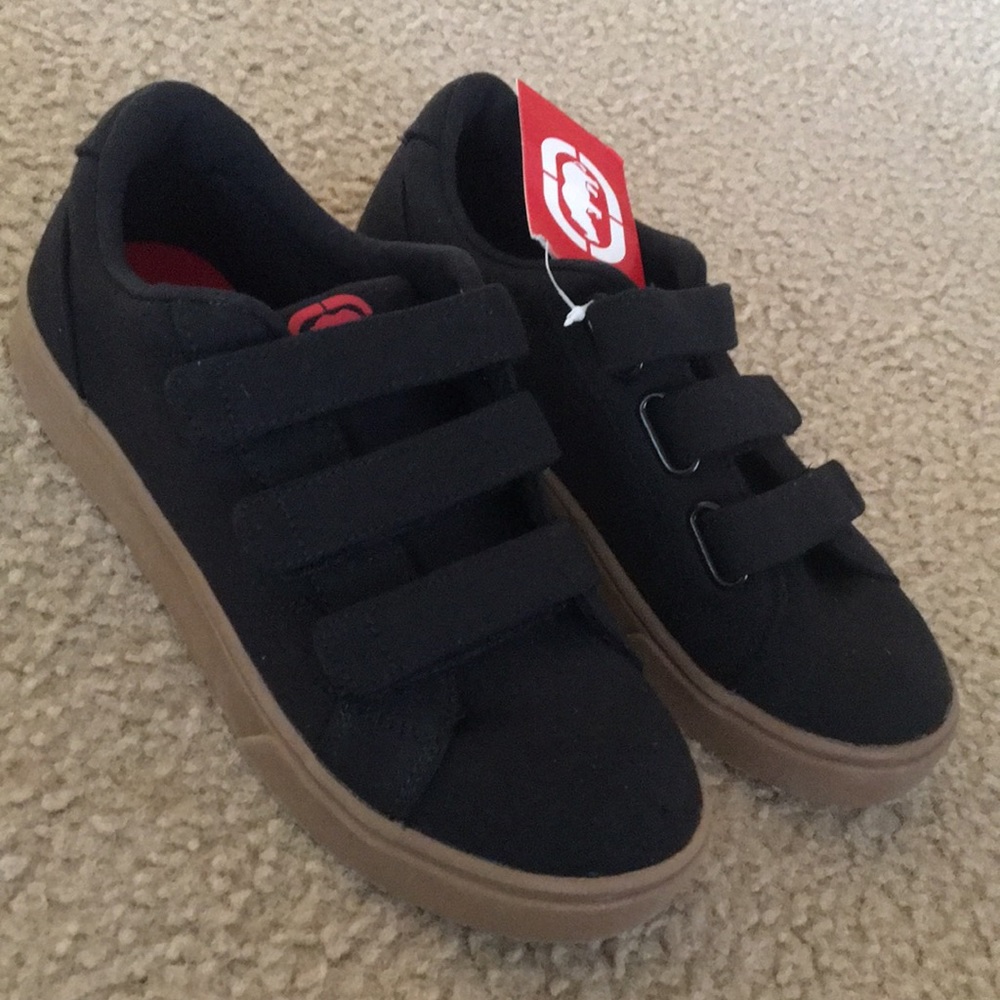 Boys black with brown low top shoes. Size 4.
